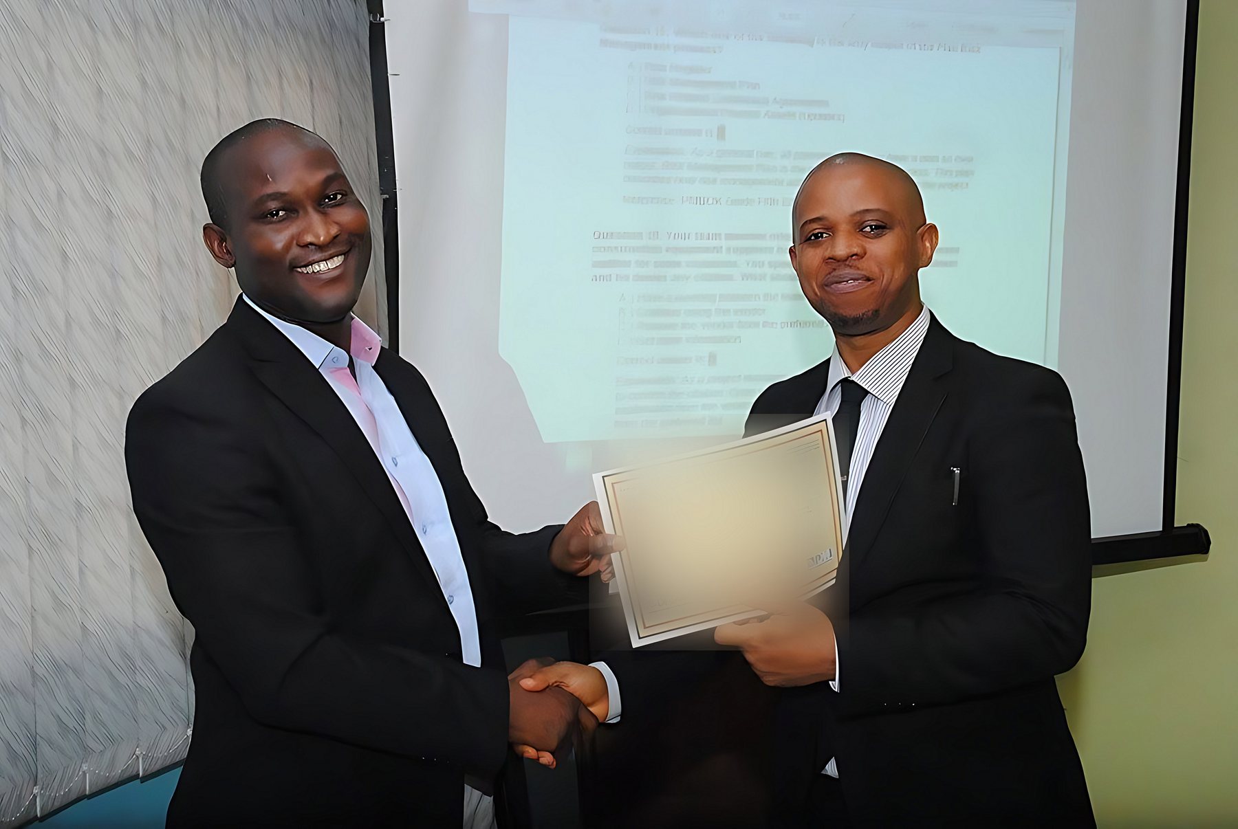 Chuba Nkala presenting a certificate to a participant